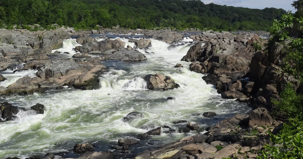The rushing river cascades over the rocks of the Potomac