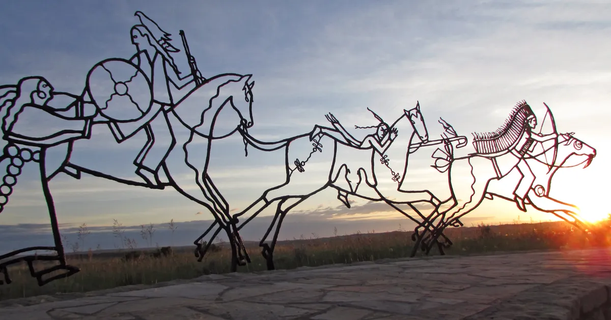 The sun sets behind the Indian Memorial.