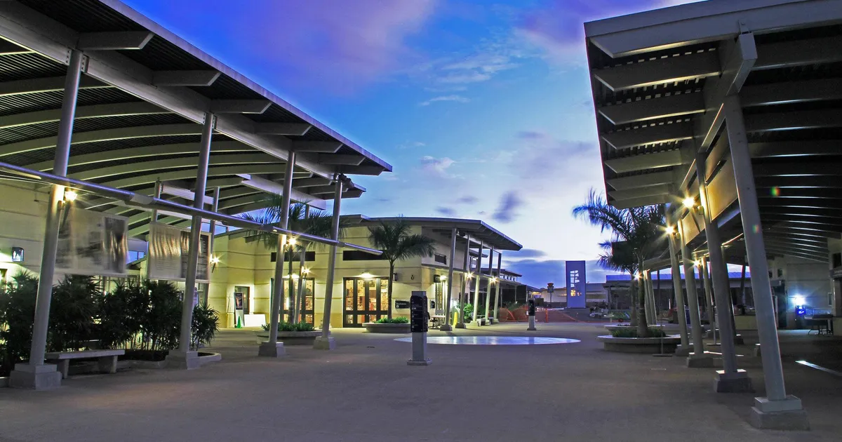 An evening photo of the Pearl Harbor Visitor Center Complex looking towards the museums.